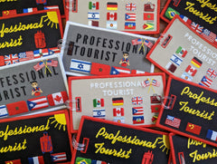 PROFESSIONAL TOURIST Luggage Tag. Worldwide! Taupe background